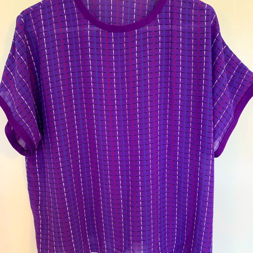 NWT Purple short sleeved blouse with various colors.